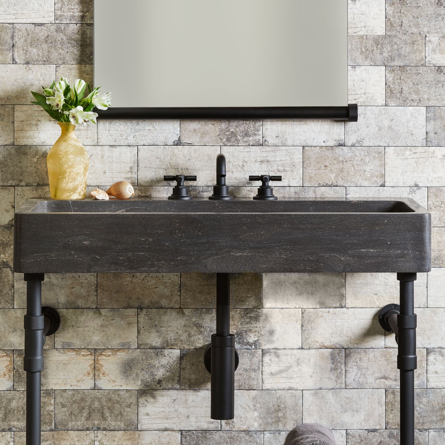 front view of Trough Bath sink in antique gray limestone