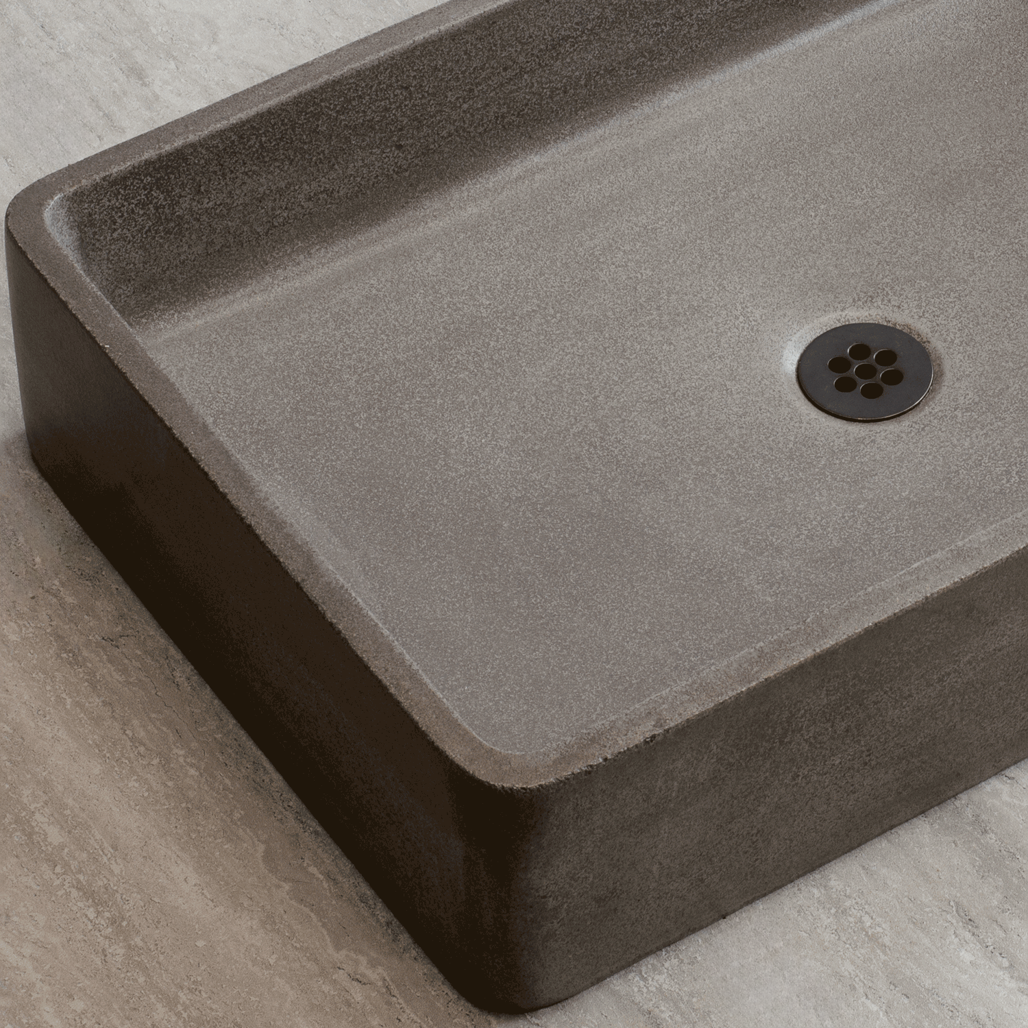 Close up Rectangular concrete sink on a light gray background