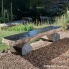 Polished top basalt bench with naturally weathered sides and legs.