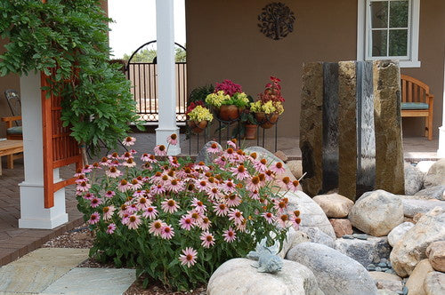 triple basalt fountains in a contemporary outdoor landscape