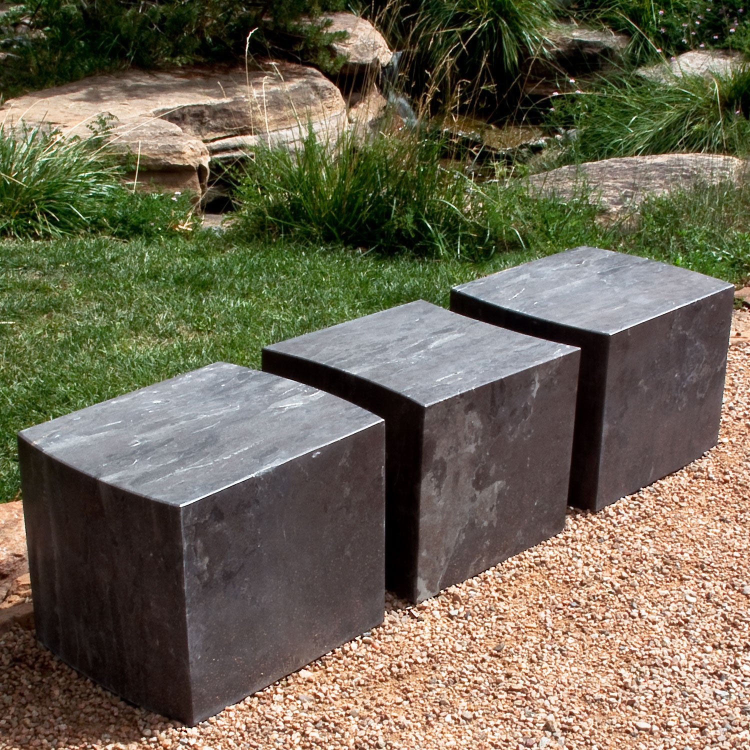 Cube seats in antique gray limestone