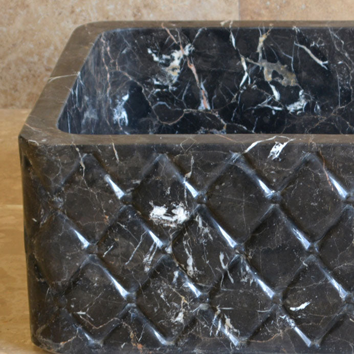 Custom farmhouse sink in nero marquina marble