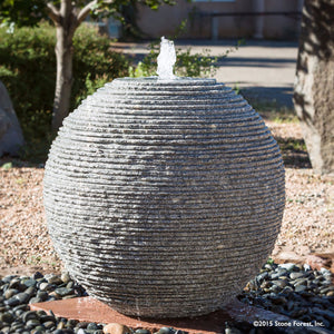 Stone Forest Ribbed Sphere garden fountain carved from black and white granite 36