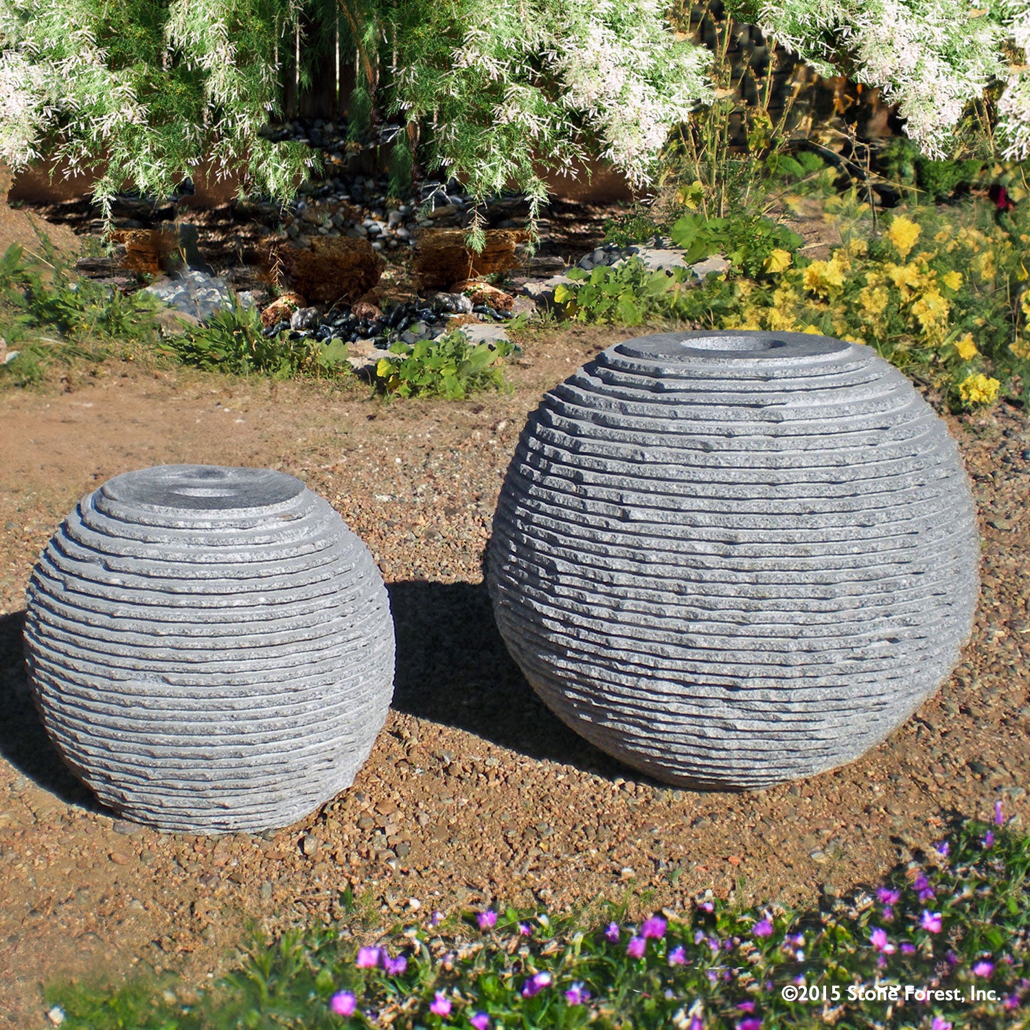 Stone Forest Ribbed Sphere garden fountain carved from black and white granite 18" & 24" high