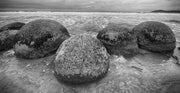 Boulders at shoreline, Large weathered stones sitting along the shore