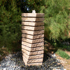 A beige granite tiered helix garden fountain.