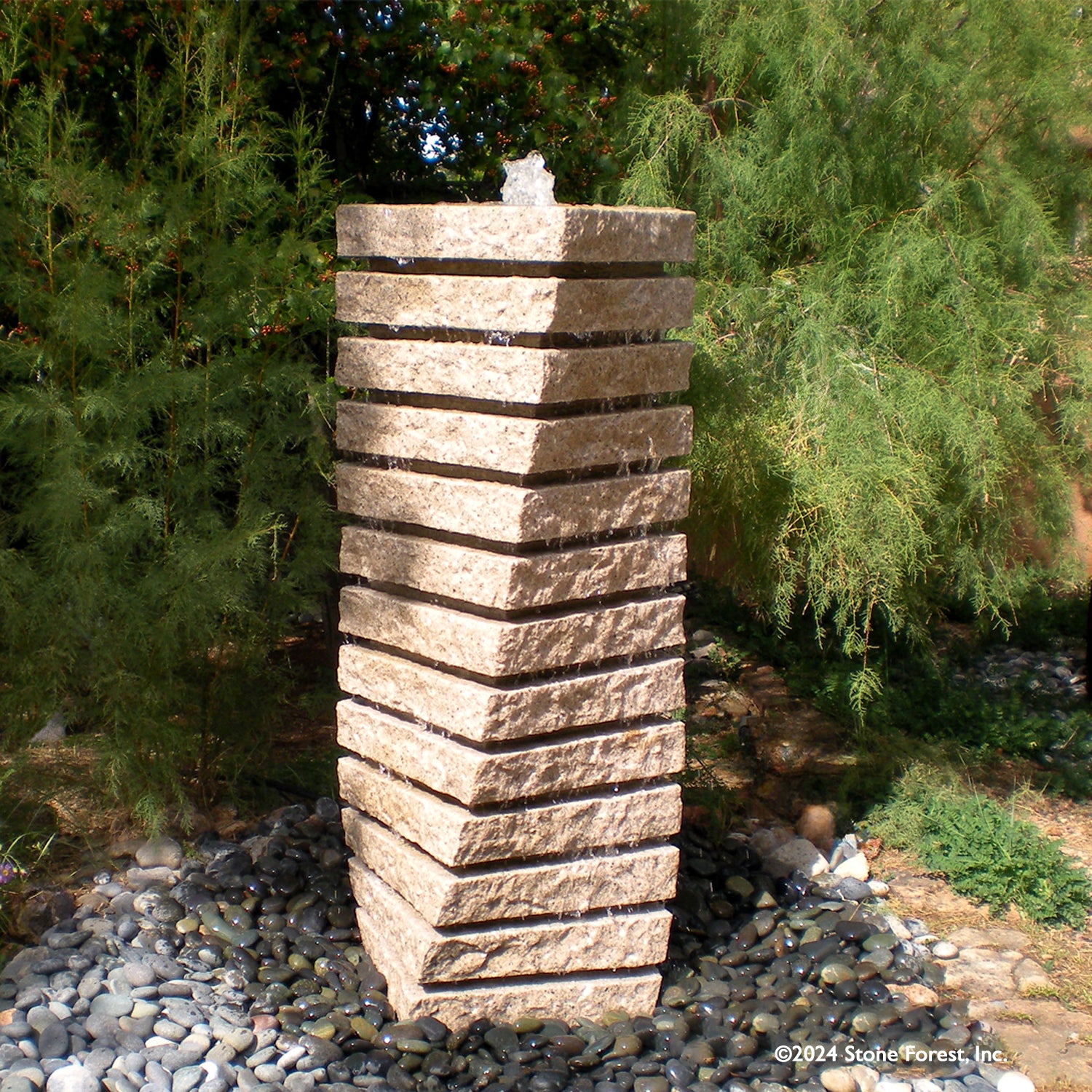 A beige granite tiered helix garden fountain.