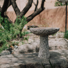 birdbath is hand-carved from Rose Granite with a rough chiseled finish
