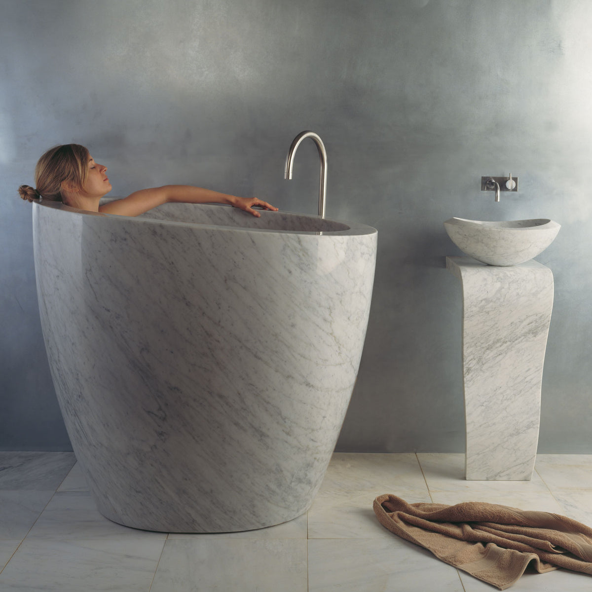 The free standing Stone Forest Eau Soaking Bathtub is hand-carved from a solid block of Carrara marble. Made on a custom basis. image 1 of 2