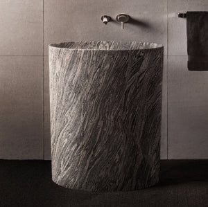 The Stone Forest Infinity Pedestal sink is carved from a single block of Cumulo Granite. image 1 of 1