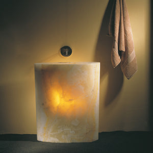 The Stone Forest Infinity Pedestal sink is carved from a single block of onyx. Onyx is a highly variable material each with unique color and veining. image 4 of 5