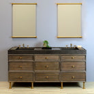 Custom Double Basin Ventus with Faucet Deck in antique gray limestone paired with Elemental Classic Vanity in aged brass with Triple Drawer Stacks