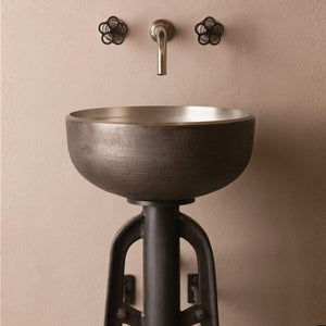 The Stone Forest white bronze Ore Vessel Sink has a raw texture on the exterior created from the sand casting method, the inside has a smooth finish image 1 of 5
