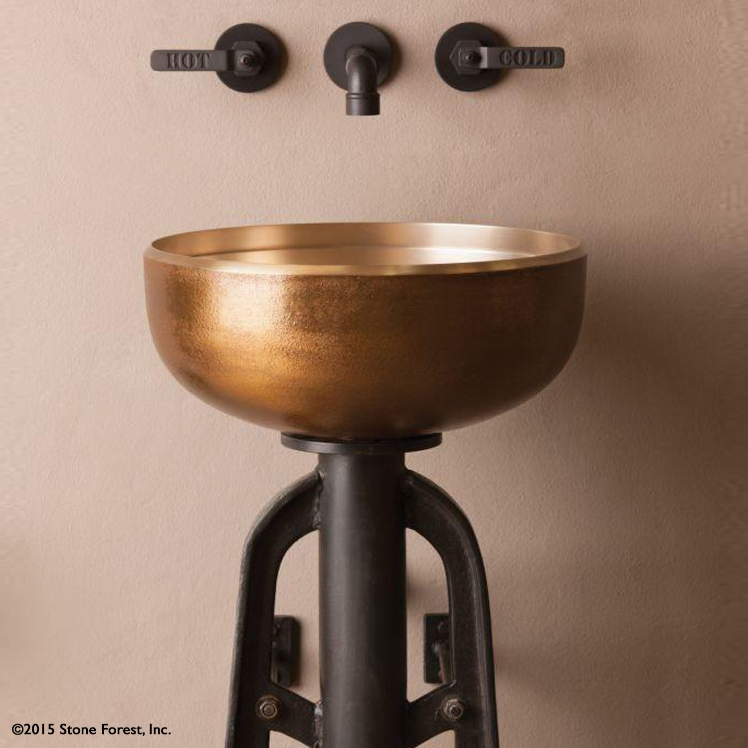 The Stone Forest golden bronze Ore Vessel Sink has a raw texture on the exterior created from the sand casting method, the inside has a smooth finish