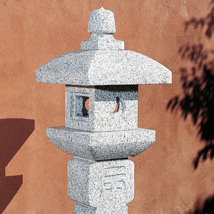 Stone Forest Oribe lantern is an ikekomi-gata-style stone lantern (post lantern) carved from black and white granite. image 3 of 3