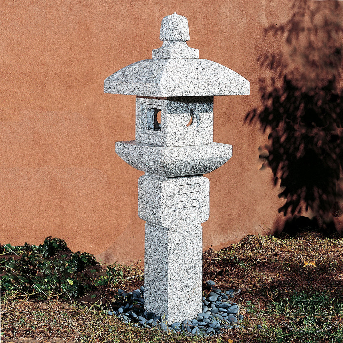 Stone Forest Oribe lantern is an ikekomi-gata-style stone lantern (post lantern) carved from black and white granite. image 2 of 3