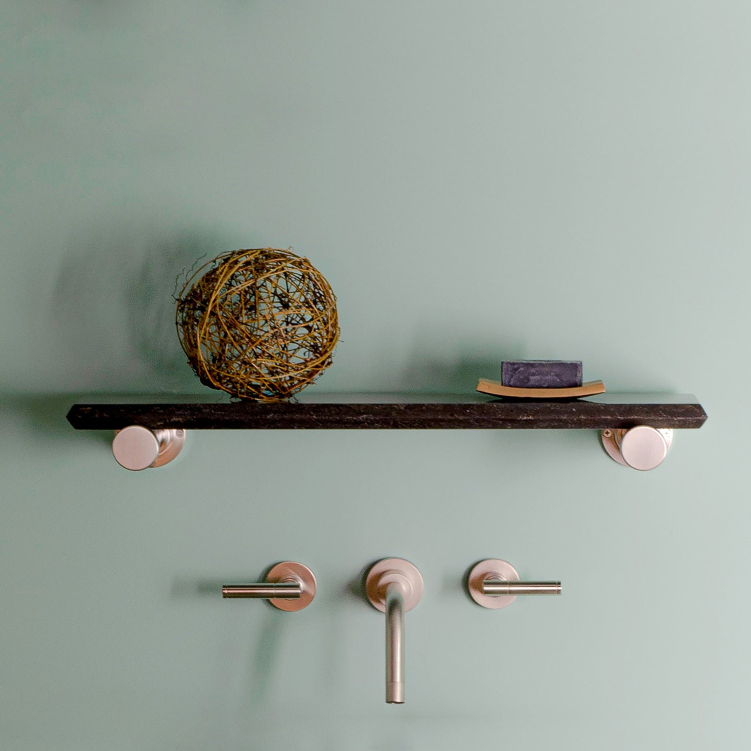 Elemental Classic Accessory Shelf in antique gray limestone and polished nickel.
