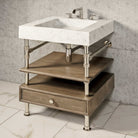 Terra Bath Sink carved from Carrara Marble with a honed finish, with a polished nickel Elemental Console Vanity with a 6"h drawer and shelf in cement gray.