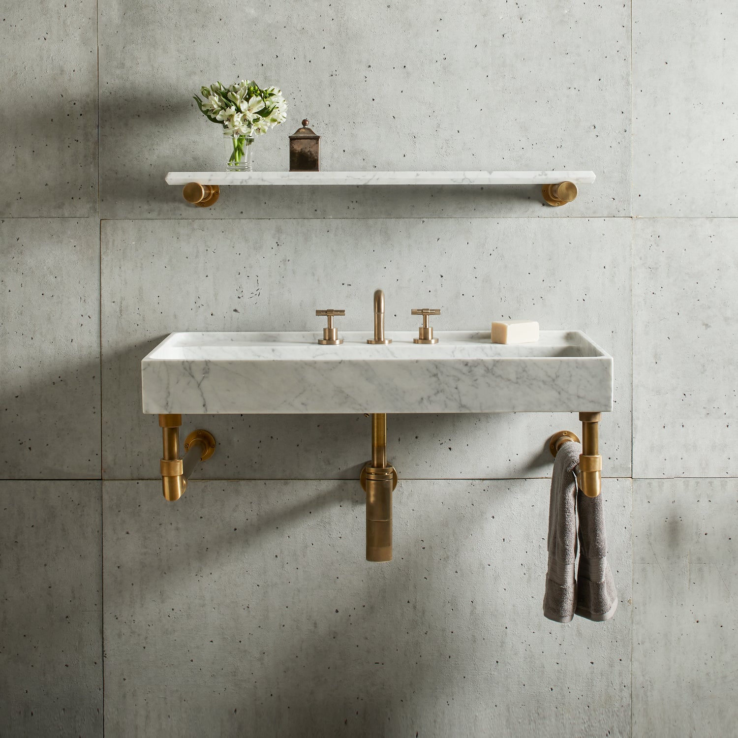 Ventus Bath Sink with Faucet Deck in carrara marble paired with Elemental Classic Wall Unit in aged brass