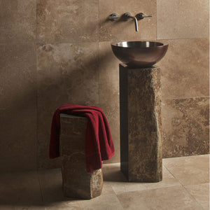 Stone Forest Basalt Pedestal cut from a solid column of natural basalt.  Each piece features polished sides with contrasting natural textures paired with a copper / stainless beveled Vessel sink. image 2 of 3