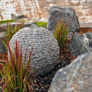 Stone Forest Ribbed Sphere garden fountain carved from black and white granite 20
