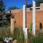Garden Ornament: Rough chiseled plinths carved from beige granite used as sculptural accents