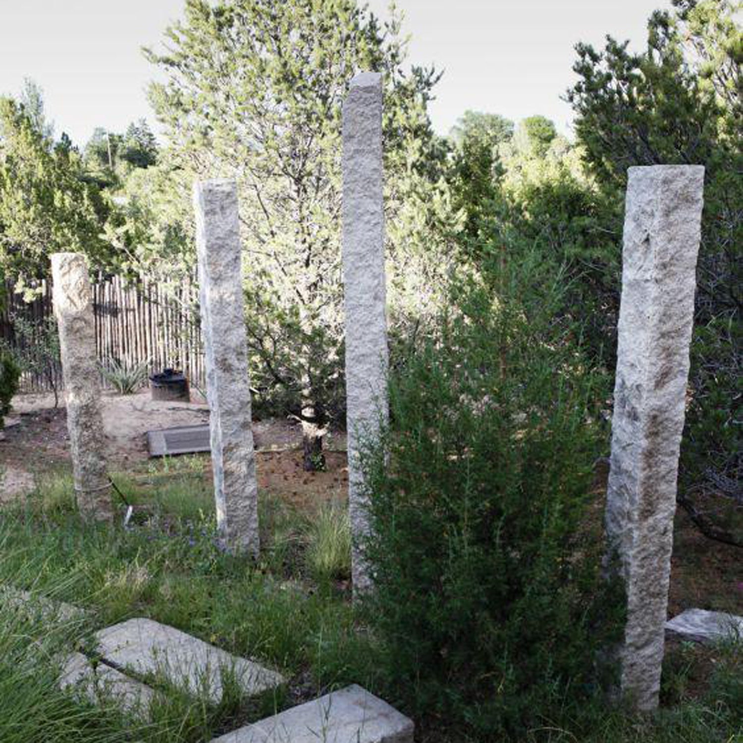 Garden Ornament: Rough chiseled plinths carved from beige granite used as sculptural accents