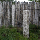 Garden Ornament: Rough chiseled plinths carved from beige granite used as sculptural accents
