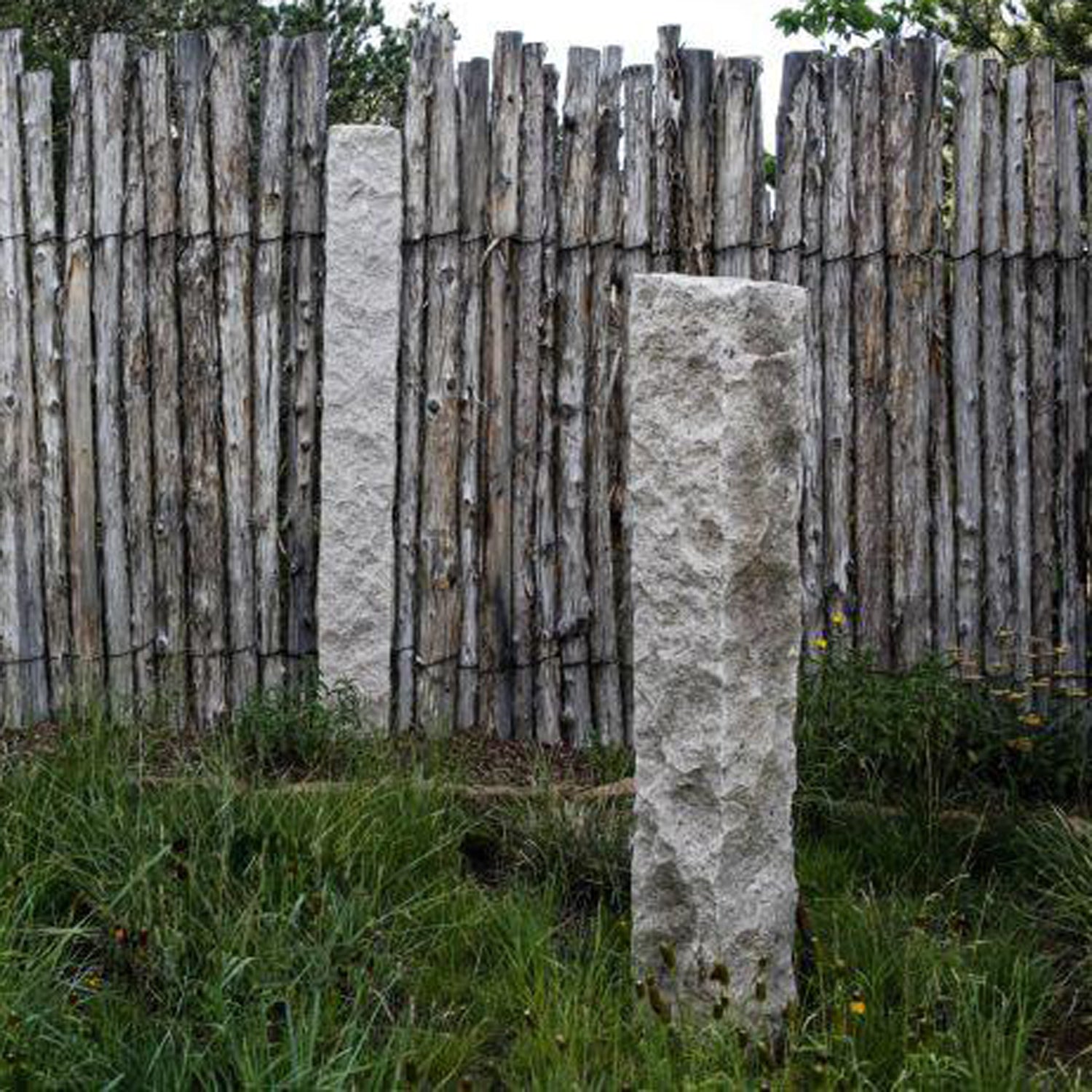 Garden Ornament: Rough chiseled plinths carved from beige granite used as sculptural accents