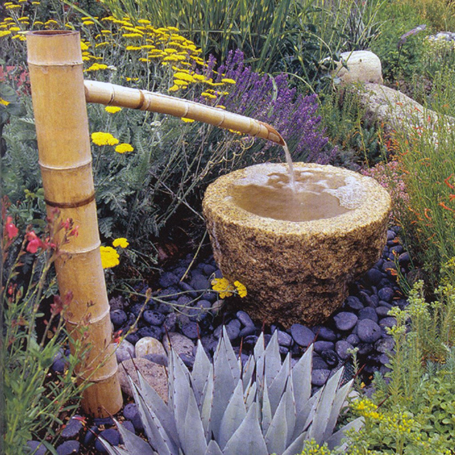 Bamboo water spout for use with basin-style fountains.