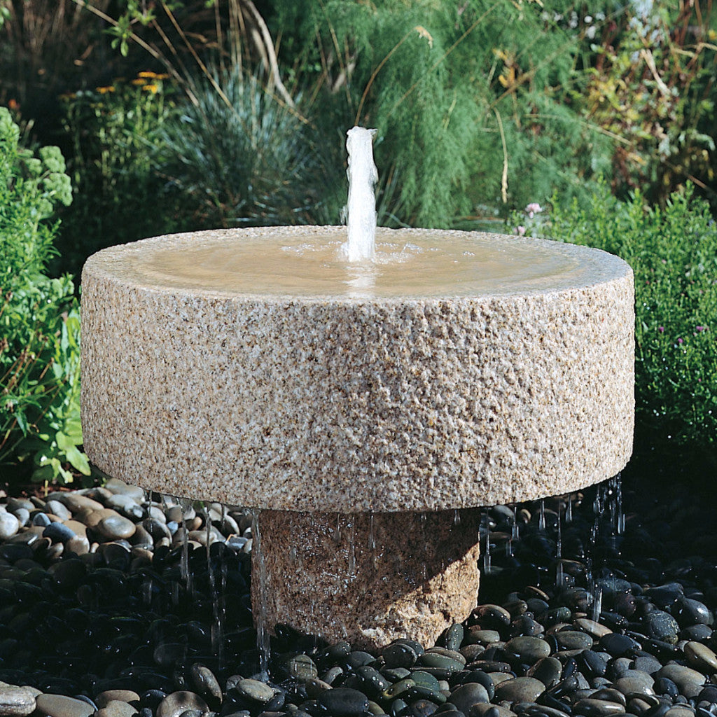 Rough millstone fountain in our outdoor garden image 1 of 1