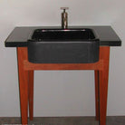 A black granite washbasin, all polished.
