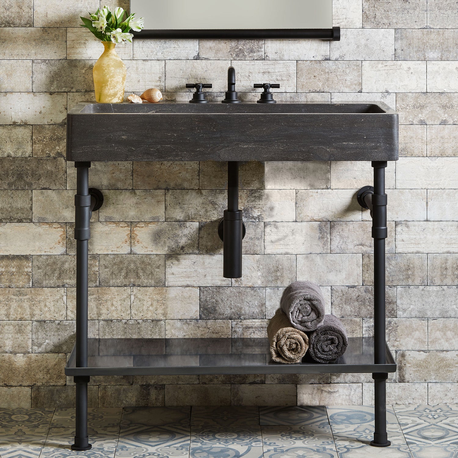 Antique gray limestone trough sink paired with a matte black elemental classic trough tray vanity.