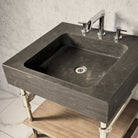 Antique gray limestone Terra bath sink with polished nickel Elemental Classic Console Vanity featuring wood drawer.