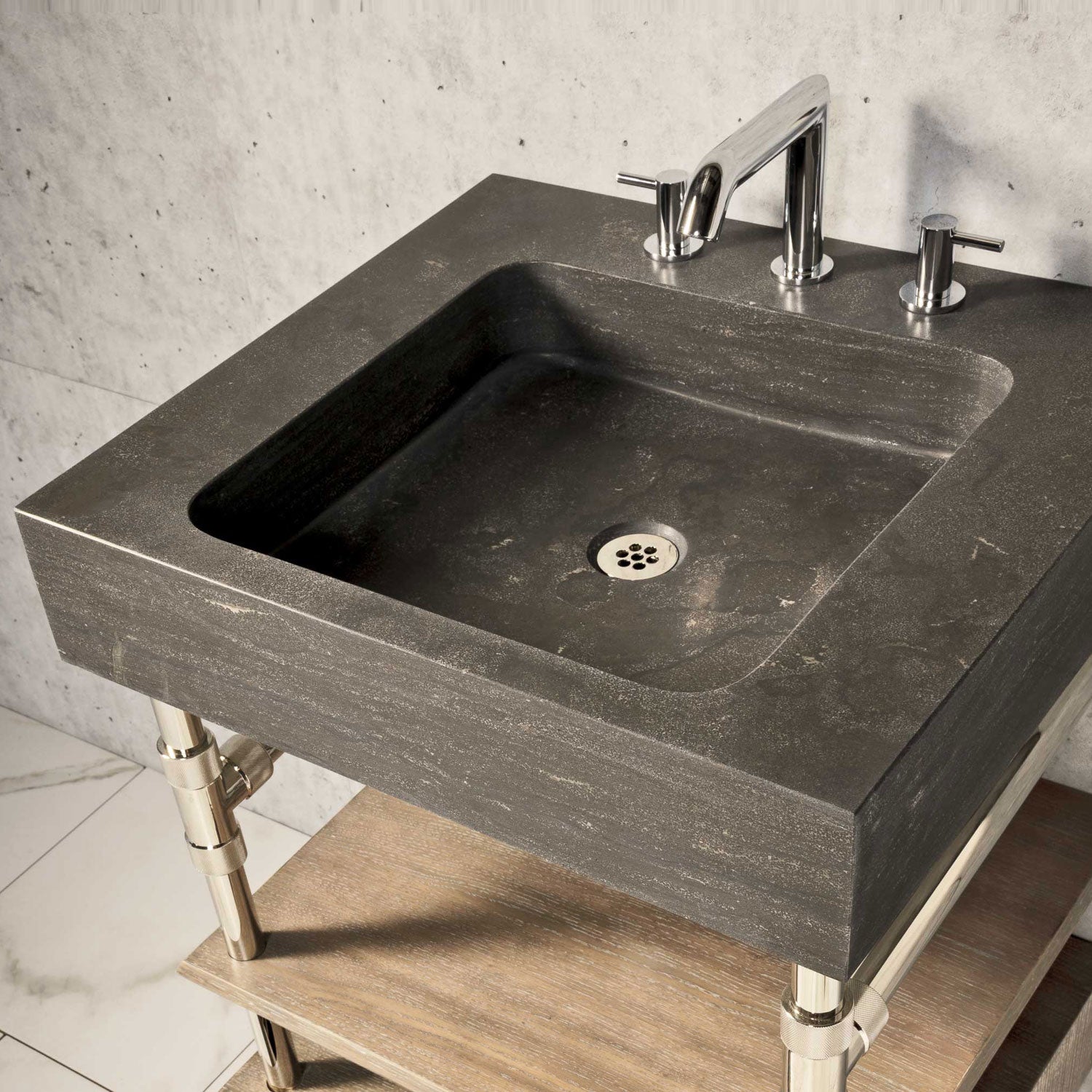 Antique gray limestone Terra bath sink with polished nickel Elemental Classic Console Vanity featuring wood drawer.