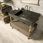 Antique gray limestone Terra bath sink supported by an Elemental Classic vanity with a wood drawer.