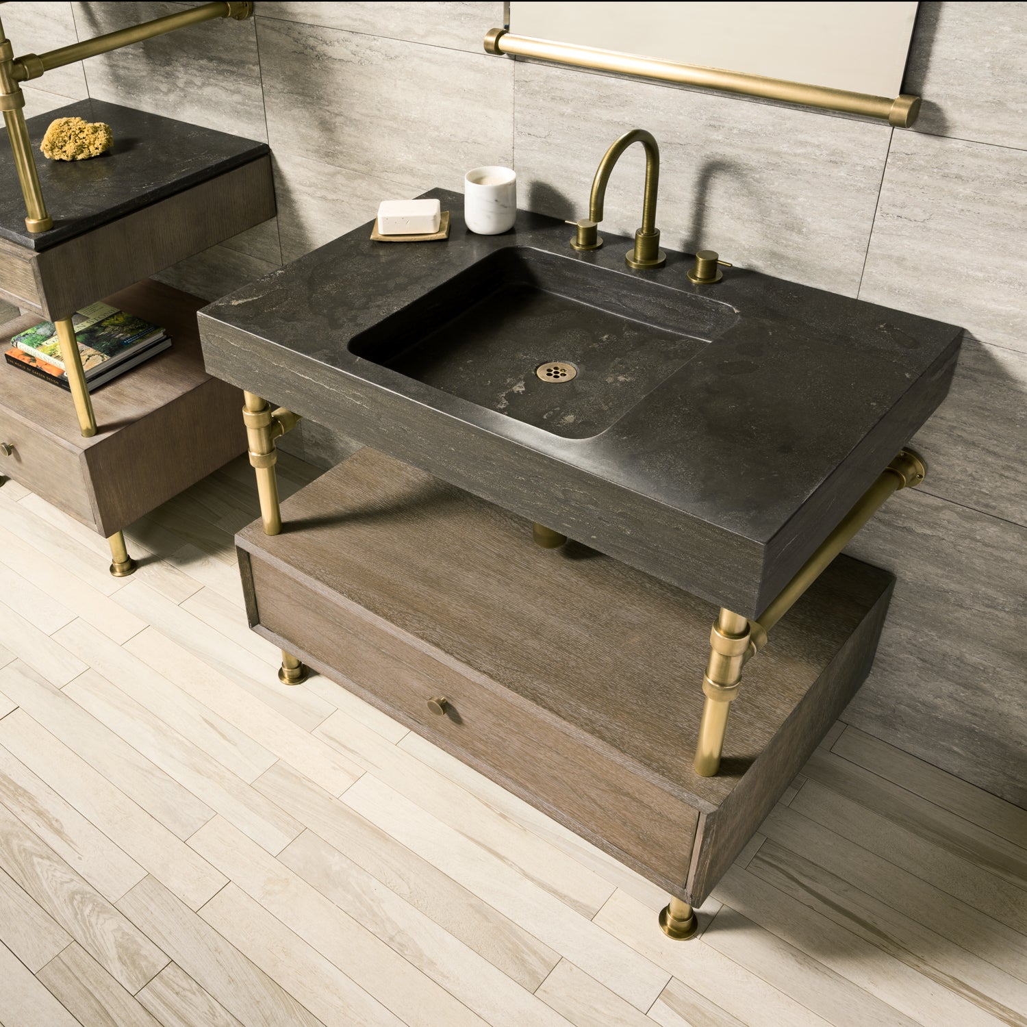 Antique gray limestone Terra bath sink supported by an Elemental Classic vanity with a wood drawer.