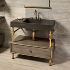 Antique gray limestone Terra bath sink supported by an Elemental Classic vanity with a wood drawer.