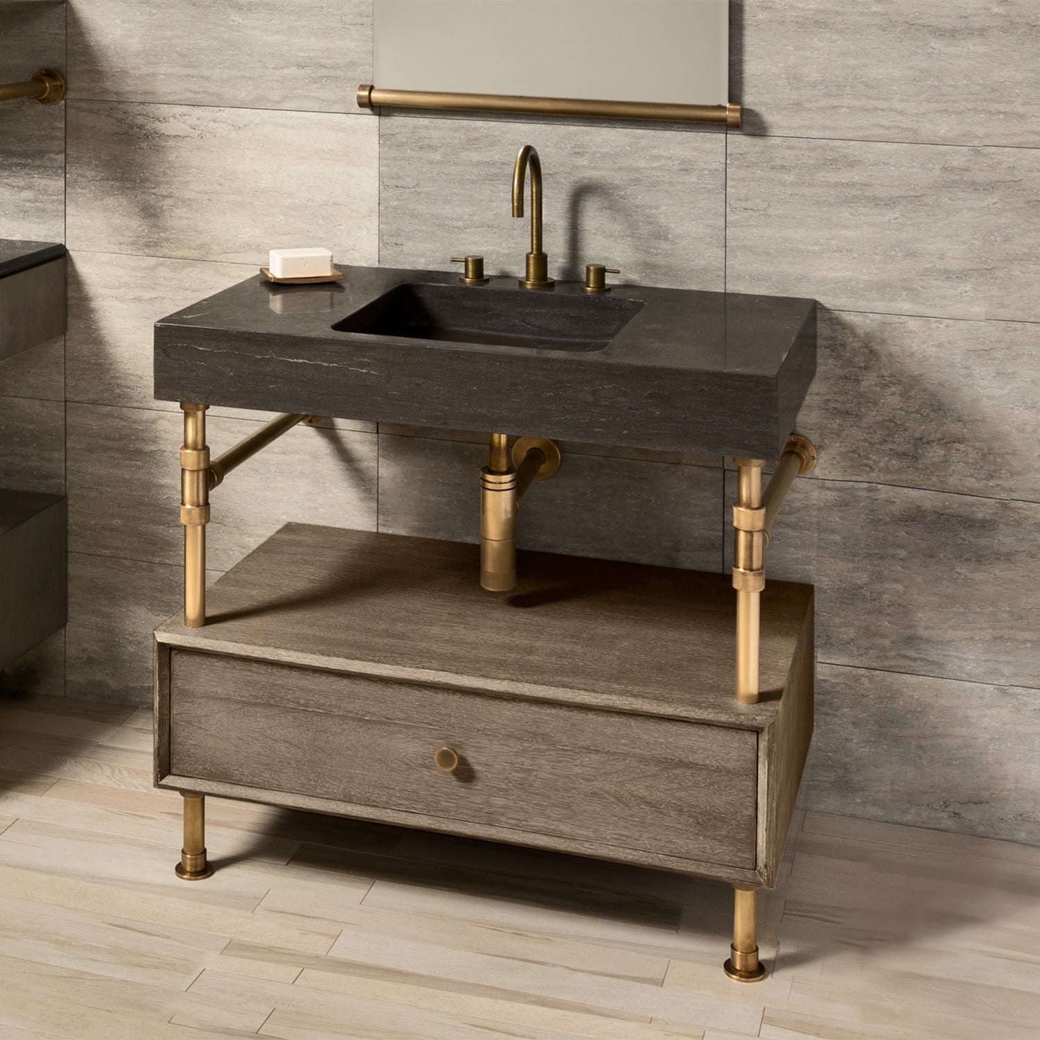 Antique gray limestone Terra bath sink supported by an Elemental Classic vanity with a wood drawer.