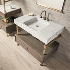A Carrara marble bath sink on an Elemental Classic Drawer Vanity with an aged brass finish and wood elements.