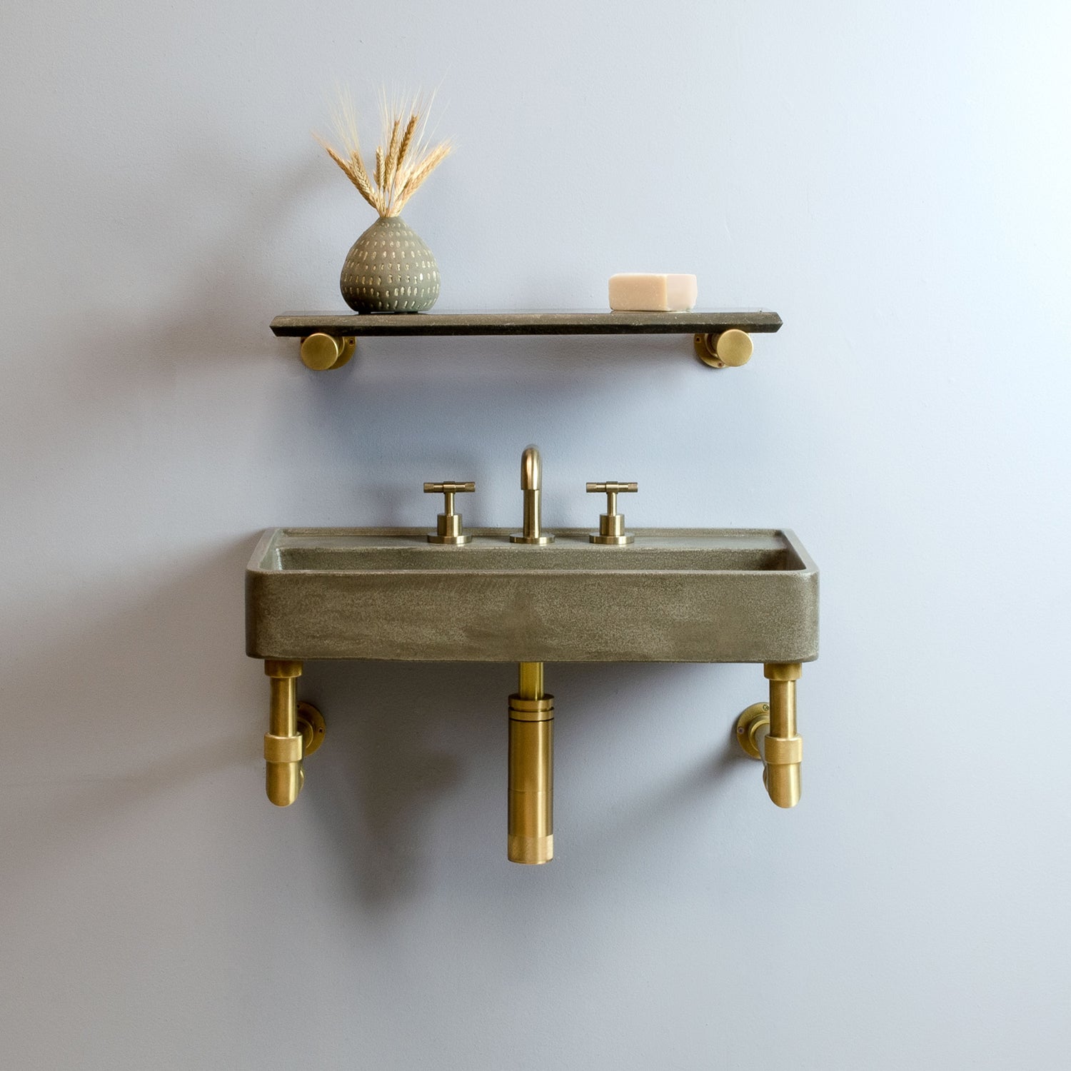Lumbre Bath Sink in concrete on Elemental Classic wall unit in aged brass