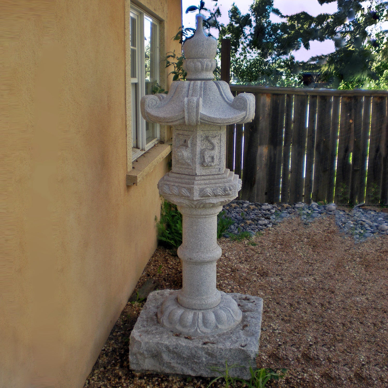 Stone Forest Kasuga-style lantern. This traditional Japanese Lantern is of the Tachi-gata-style or pedestal stone lanterns. Carved from black & white (salt & pepper) granite. 68"h